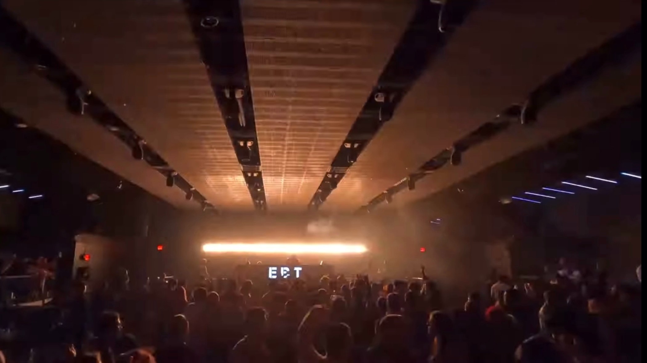 E B T marquee over a warm-lit room